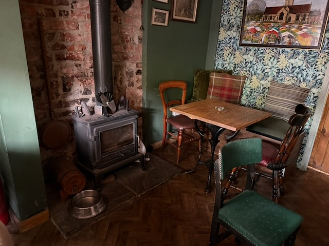 Table beside a wood-burning stove